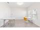 Bright home office with natural light, tile flooring, and contemporary furniture at 1813 Castleton Dr, St Cloud, FL 34771