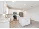 Bright kitchen with white cabinets, a center island, and stainless steel appliances at 1813 Castleton Dr, St Cloud, FL 34771