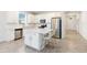 Modern kitchen with stainless steel appliances, a white island, and lots of storage at 1813 Castleton Dr, St Cloud, FL 34771