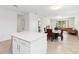 Open-concept living space with a kitchen island, dining area, and living room at 1813 Castleton Dr, St Cloud, FL 34771