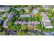 Aerial view of community featuring tennis courts, pool, and residential buildings at 2013 Dixie Belle Dr # F, Orlando, FL 32812