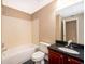 Clean bathroom with a large vanity and tub shower combo at 2013 Dixie Belle Dr # F, Orlando, FL 32812