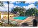 Inviting community pool with surrounding patio and lounge chairs at 2013 Dixie Belle Dr # F, Orlando, FL 32812