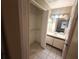 Bathroom with single sink vanity and linen closet at 2024 Trinidad Ct, Kissimmee, FL 34741