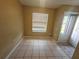 Condo breakfast nook with tile flooring and window at 2024 Trinidad Ct, Kissimmee, FL 34741