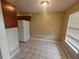 Condo dining area with tile flooring and window at 2024 Trinidad Ct, Kissimmee, FL 34741