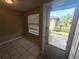 Bright entryway with tile flooring and view of backyard at 2024 Trinidad Ct, Kissimmee, FL 34741