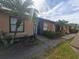 Condo building exterior with walkway and landscaping at 2024 Trinidad Ct, Kissimmee, FL 34741