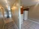 Condo hallway with tile flooring and access to rooms at 2024 Trinidad Ct, Kissimmee, FL 34741