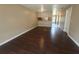 Open living room with dark laminate wood flooring at 2024 Trinidad Ct, Kissimmee, FL 34741