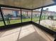 Screened porch overlooking a fenced backyard at 2024 Trinidad Ct, Kissimmee, FL 34741