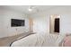 Bedroom featuring neutral carpeting, a ceiling fan, and multiple doors at 2352 Tay Wes Dr, St Cloud, FL 34771