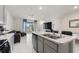 Open concept kitchen and living area with modern finishes and plenty of natural light at 2352 Tay Wes Dr, St Cloud, FL 34771