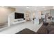 Open-concept living space featuring tile floors, a modern kitchen, and comfortable seating at 2352 Tay Wes Dr, St Cloud, FL 34771