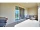 Covered patio with a comfortable seating area and a grill for outdoor cooking at 2352 Tay Wes Dr, St Cloud, FL 34771