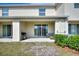 Covered patio with a grill, sliding glass doors, and outdoor seating area at 2352 Tay Wes Dr, St Cloud, FL 34771