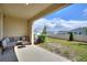 Covered patio with a seating area overlooking the backyard and neighborhood at 2352 Tay Wes Dr, St Cloud, FL 34771