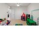 Large playroom with toys, including a play tent and a -size table and chairs at 2352 Tay Wes Dr, St Cloud, FL 34771