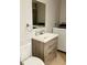 Clean bathroom with updated vanity and laundry hookups at 2403 Melissa Ann Ct, Kissimmee, FL 34746