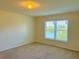 Bedroom with window offering a water view at 2403 Melissa Ann Ct, Kissimmee, FL 34746