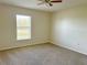 Well-lit bedroom with ceiling fan and neutral decor at 2403 Melissa Ann Ct, Kissimmee, FL 34746