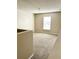 Spacious bedroom with carpeted floors and a large window at 2403 Melissa Ann Ct, Kissimmee, FL 34746