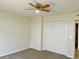 Bedroom with double door closet and ceiling fan at 2403 Melissa Ann Ct, Kissimmee, FL 34746