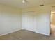 Bedroom with double door closet and neutral walls at 2403 Melissa Ann Ct, Kissimmee, FL 34746