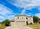 Two-story house with a two-car garage and a spacious front yard at 2403 Melissa Ann Ct, Kissimmee, FL 34746