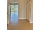 Hallway with tile floors and access to backyard at 2403 Melissa Ann Ct, Kissimmee, FL 34746