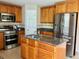Modern kitchen with stainless steel appliances and granite countertops at 2403 Melissa Ann Ct, Kissimmee, FL 34746