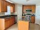 Kitchen with granite countertops and wood cabinets at 2403 Melissa Ann Ct, Kissimmee, FL 34746