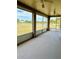 Spacious screened porch with a view of a pond at 2403 Melissa Ann Ct, Kissimmee, FL 34746