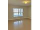 Spacious bedroom with tile floors and a large window at 2403 Melissa Ann Ct, Kissimmee, FL 34746