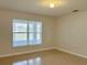 Bright bedroom with tile floors and a large window at 2403 Melissa Ann Ct, Kissimmee, FL 34746