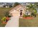 Attractive single-Gathering home with a two-car garage and manicured lawn at 2542 Bobby Lee Ln, St Cloud, FL 34772