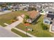 Single-Gathering home with a landscaped yard, driveway, and palm trees at 2542 Bobby Lee Ln, St Cloud, FL 34772