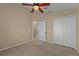 Bedroom with double doors leading to another room at 2542 Bobby Lee Ln, St Cloud, FL 34772