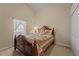 Bedroom with wooden bed frame and dresser at 2542 Bobby Lee Ln, St Cloud, FL 34772