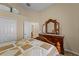 Bedroom with a wooden dresser and a double door closet at 2542 Bobby Lee Ln, St Cloud, FL 34772