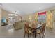 Charming dining room with dark wood table and views to the living room at 2542 Bobby Lee Ln, St Cloud, FL 34772