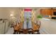 Formal dining room with a large table and kitchen access at 2542 Bobby Lee Ln, St Cloud, FL 34772