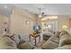 Comfortable living room with L-shaped sofa and sliding glass doors at 2542 Bobby Lee Ln, St Cloud, FL 34772