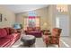 Living room features comfortable seating and a view to the outdoors at 2542 Bobby Lee Ln, St Cloud, FL 34772