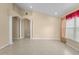 Spacious living room with vaulted ceiling, tile floors, and L-shaped sofa at 2542 Bobby Lee Ln, St Cloud, FL 34772