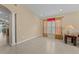 Bright living room featuring tile floors and kitchen views at 2542 Bobby Lee Ln, St Cloud, FL 34772