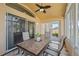 Bright sunroom with table and chairs, perfect for relaxing and enjoying the view at 2542 Bobby Lee Ln, St Cloud, FL 34772