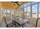 Bright sunroom with table and chairs, perfect for relaxing and enjoying the view at 2542 Bobby Lee Ln, St Cloud, FL 34772
