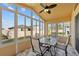 Bright sunroom with table and chairs, perfect for relaxing and enjoying the view at 2542 Bobby Lee Ln, St Cloud, FL 34772