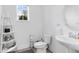 Clean and bright bathroom with white vanity and a round mirror at 2935 Rapollo Ln, Apopka, FL 32712